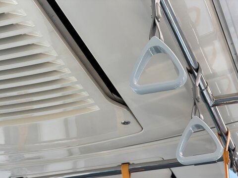 Hand grip strap handle inside MRT train for standing passengers, public transportation interior