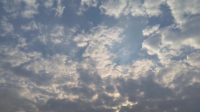 Horizontal Conceptual Shot of Fluffy Clouds Forming an Ocean of Cotton with Silver Lining and Heavenly Sunbeams