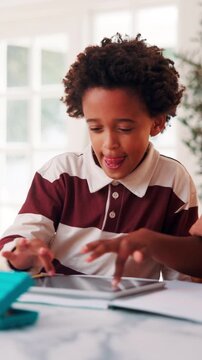 Children, home or learning with tablet for online education, activity or interaction together. African boy, kids or playing with technology for academic game, entertainment or engagement in house