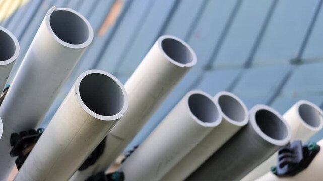 Industrial plastic pipes on a storage rack