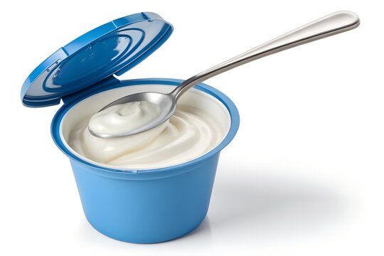 Creamy white yogurt served in a vibrant blue plastic container with a shiny silver metal spoon resting on top against a clean bright white background