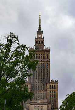 Palace of Culture and Science, clock tower in Warsaw, city, skyline on a cloudy day. 02/30/2022 Poland, Warsaw.