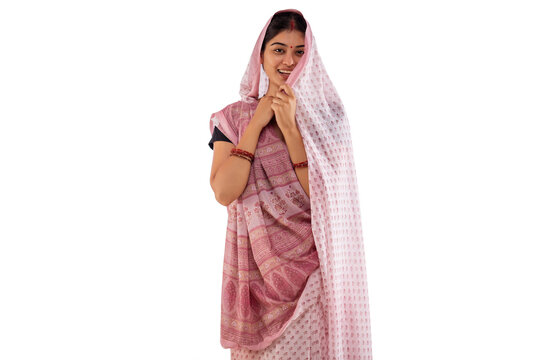 Portrait of a shy Bihar woman against white background