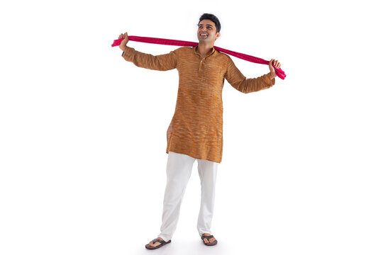 Portrait of a farmer standing with arms outstretched against white background