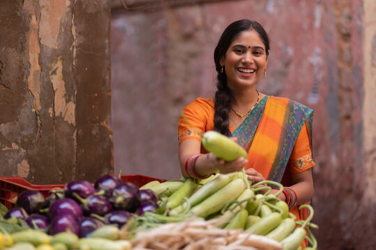 Woman buying vegetable from street market