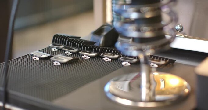 Actuator engaging is lowering spiral tool and brushes over metal tabs on work mat for alignment