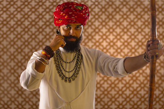Portrait of Rajasthani young man twisting his moustache