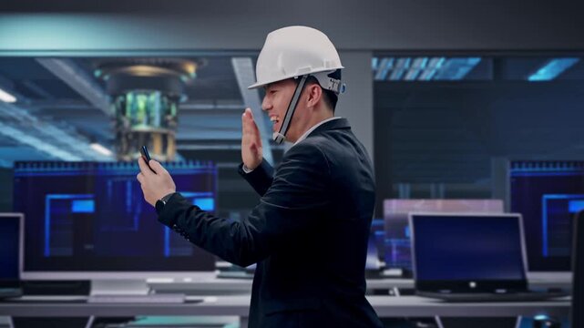 Side View of Asian Businessman Use Smartphone, Video Call While Walking at Futuristic Quantum Computer Data Center Control Room