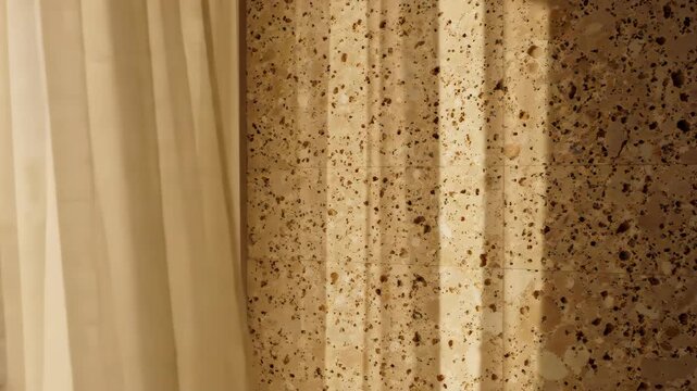 Abstract Textured Wall Surface with Speckled Pattern and Soft Fabric Folds.