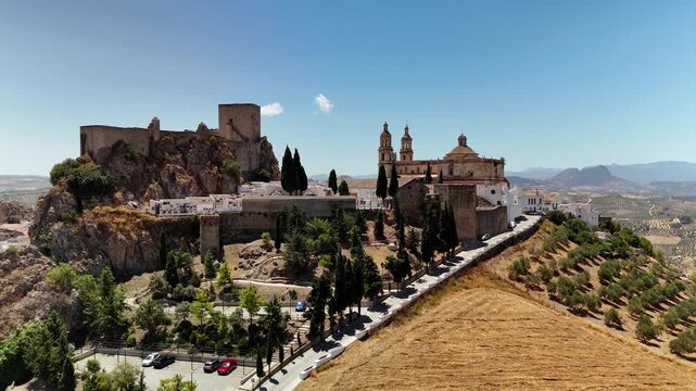 Aerial view of Olvera Castle and church on hilltop, Andalusia, Spain