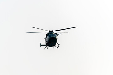 Helicopter is flying on isolated white background © suman