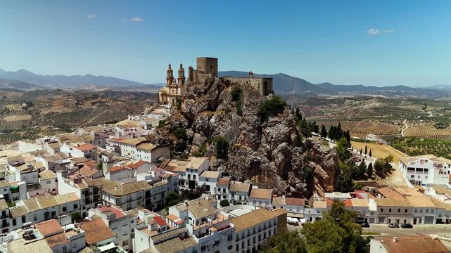 Aerial drone view of Olvera Castle and church, white village, Andalusia, Spain
