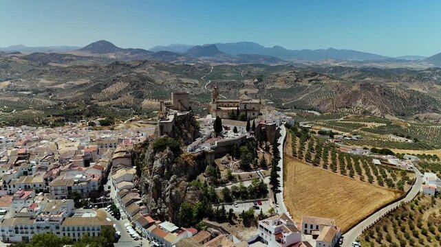 Aerial wide pan of olive groves and countryside surrounding Olvera, Cadiz, Spain