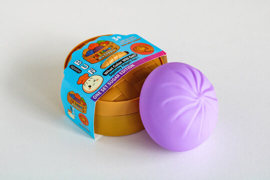 Moscow, Russia - July 09, 2026: Rainbow Mystery Bun Squishy fidget toy with original One Set Sugar Edition packaging on white background.