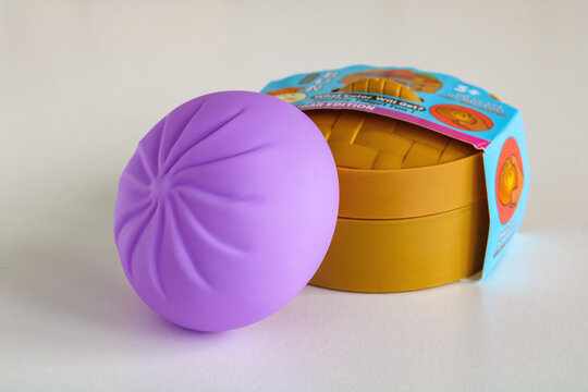 Moscow, Russia - July 09, 2026: Rainbow Mystery Bun Squishy fidget toy displayed with original One Set Sugar Edition retail packaging on white background