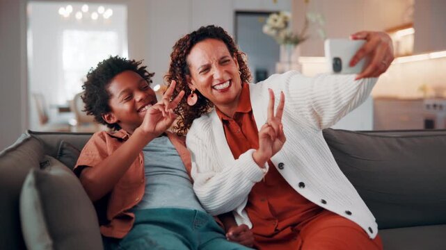 Mother, kid and peace sign in home with selfie, smile and social media post for childhood memories. Happy, African woman and son in living room with photography, v gesture or family bonding together.