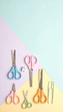 Collection of Colorful Scissors and Craft Supplies on Pastel Background.