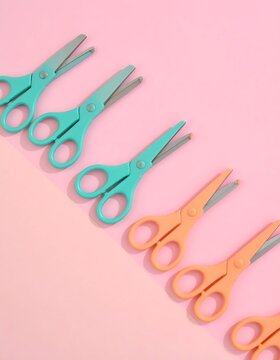 Diagonal Pattern of Colorful Scissors on Pastel Pink Background.