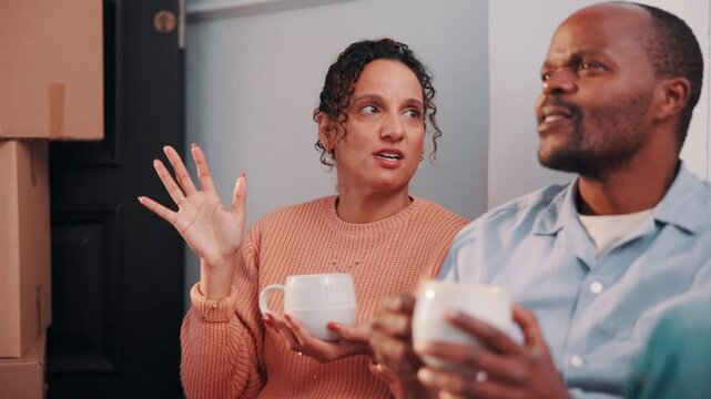 Couple, discussion and moving in new home with coffee, opinion and resolution for interior design issue. Married, mature African people and talk in house with drink, real estate and problem solving.