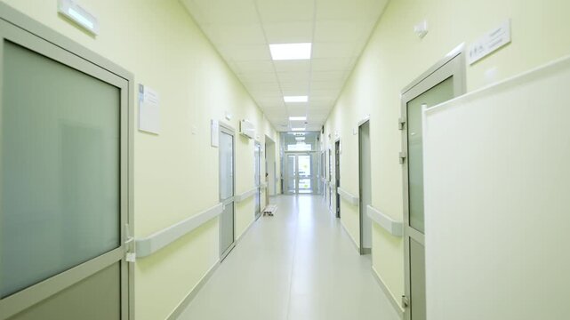 Corridor of private clinic features modern consultation rooms and comfortable patient wards. Patient wards designed for rest and recovery