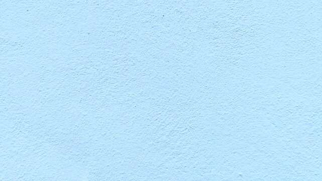 Light blue wall texture background, pastel blue concrete surface, solid color backdrop for design