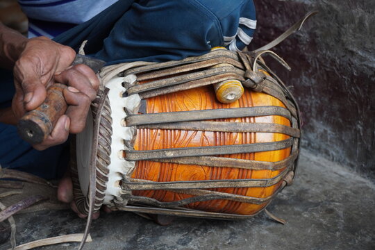 Artisan Repairing Traditional Indian Mridangam Drum