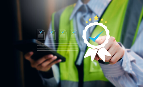 Quality assurance concept. Construction worker selecting certified digital documents with check mark badge for compliance inspection