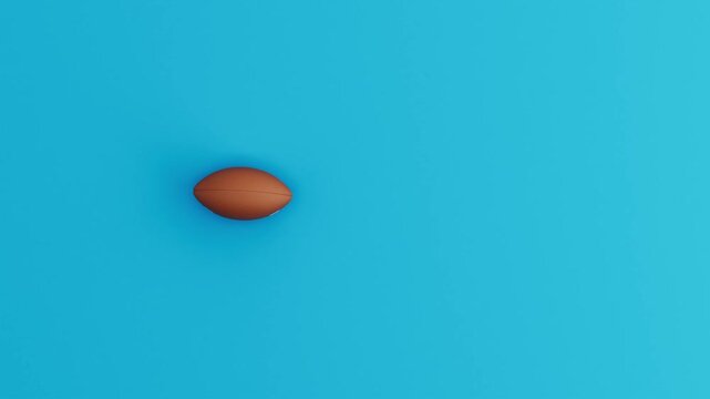 American Football Ball Rolling in Circular Loop on Blue Background. 3D Animation.