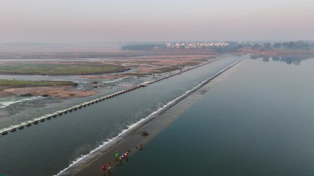 Scenic Aerial View of Check Dam on a River with Flowing Water, Lush Green Surroundings, Calm Reservoir, Rural Landscape, Water Conservation Structure and Beautiful Natural Scenery