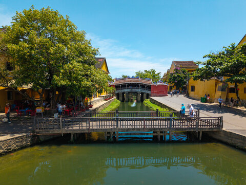 Aerial view of Chua Cau or Japanese Covered ancient Bridge and River in Old city of Hoi An, Vietnam. One of the most travel popular touristic destinations, UNESCO world heritage 