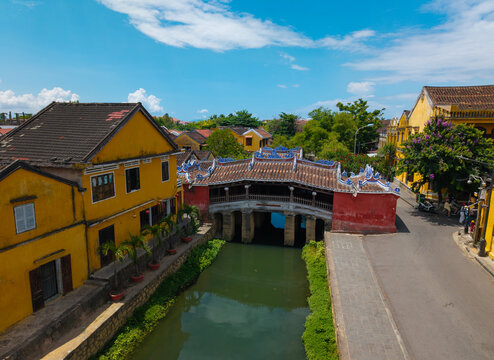 Aerial view of Chua Cau or Japanese Covered ancient Bridge and River in Old city of Hoi An, Vietnam. One of the most travel popular touristic destinations, UNESCO world heritage 