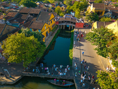 Aerial view of Chua Cau or Japanese Covered ancient Bridge and River in Old city of Hoi An, Vietnam. One of the most travel popular touristic destinations, UNESCO world heritage 