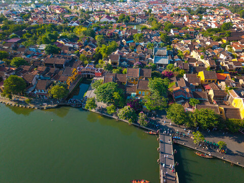 Aerial view of Chua Cau or Japanese Covered ancient Bridge and River in Old city of Hoi An, Vietnam. One of the most travel popular touristic destinations, UNESCO world heritage 