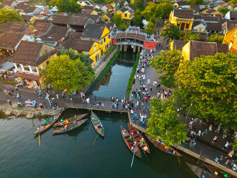 Aerial view of Chua Cau or Japanese Covered ancient Bridge and River in Old city of Hoi An, Vietnam. One of the most travel popular touristic destinations, UNESCO world heritage 