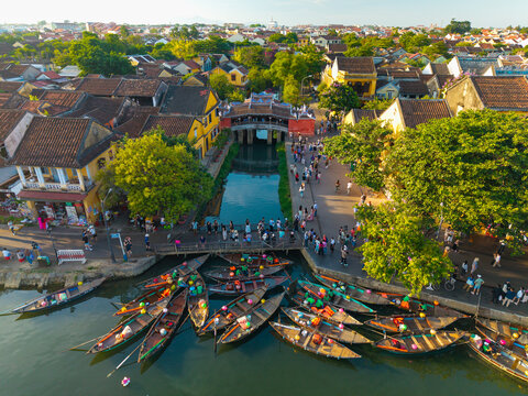 Aerial view of Chua Cau or Japanese Covered ancient Bridge and River in Old city of Hoi An, Vietnam. One of the most travel popular touristic destinations, UNESCO world heritage 