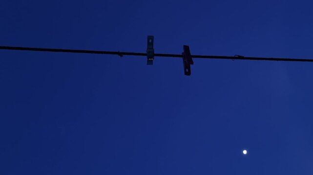 Clothespins on clothesline under full moon twilight sky with nature audio