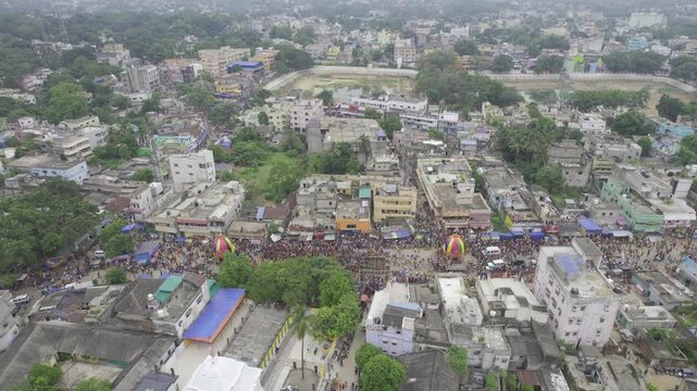 Aerial drone footage of the Rath Yatra festival in Odisha, India, showing decorated chariots, thousands of devotees, and the vibrant atmosphere of this iconic Hindu religious procession.