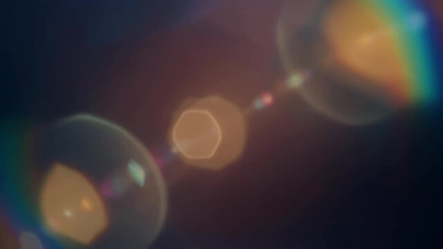 複数の光が連なる虹色のレンズフレア背景