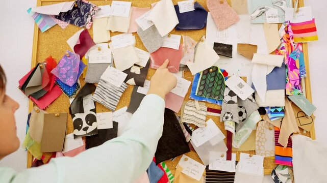 Fashion designer choosing textile swatches on a mood board