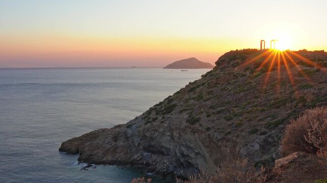 Scenic sunset over the Temple of Poseidon in Cape Sounion, Greece