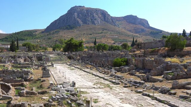 Ancient Corinth ruins with Acrocorinth hill in the background