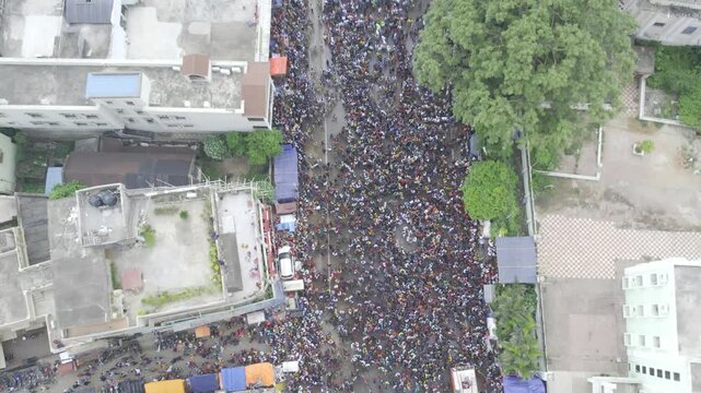Aerial drone footage of the Rath Yatra festival in Odisha, India, showing decorated chariots, thousands of devotees, and the vibrant atmosphere of this iconic Hindu religious procession.