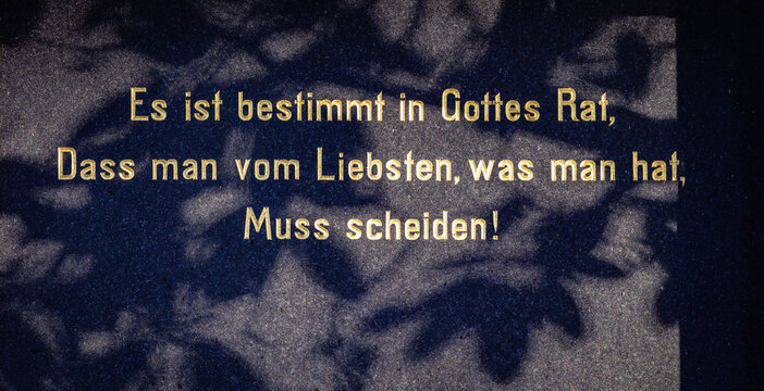 German inscription on dark tombstone regarding loss