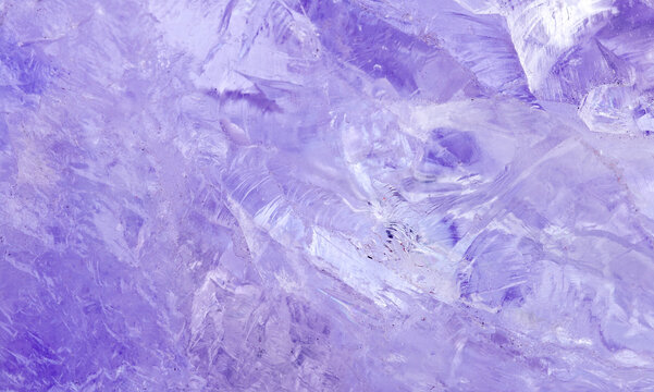 amethyst crystal displays frozen textures with cool blue hues. The icy surface of the gemstone