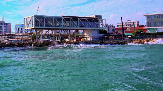 Aerial video at Limassol promenade on a sunny windy winter day