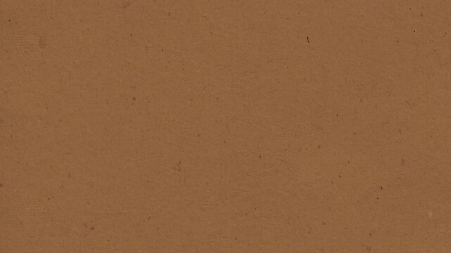 Textured brown paper background surface showing subtle fiber movement in this seamless looping digital motion animation