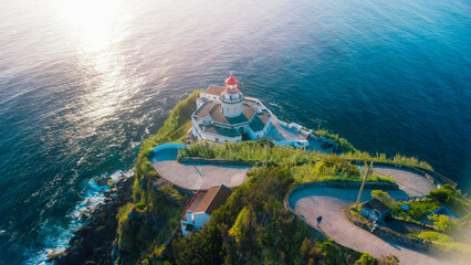Arnel lighthouse on sao miguel island at sunset © Alberto