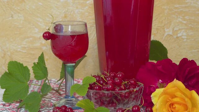Red currant wine and fresh berries close up, Homemade red currant wine in glass on rustic table still life