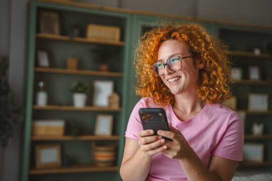 Young woman smiling using smartphone for communication