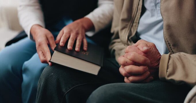Hands, bible and people in home with prayer, study and Christian faith with volunteer in living room. Senior person, caregiver and scripture for spiritual knowledge, wisdom or support in retirement